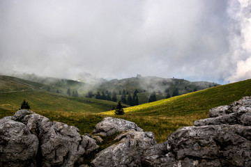 High plateau of Velika Planina, land of pastures and alpine huts high in the mountains, Slovenian Alps