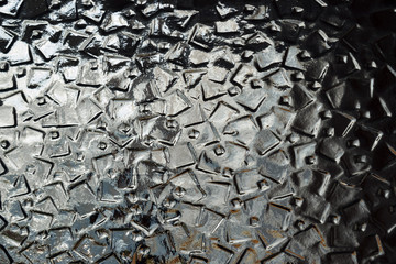 Riffled glass surface texture background. 