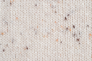 Beige melange fabric knitted texture background. Cotton jersey. Closeup