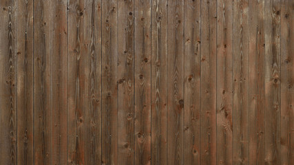 Stained natural wood plank background. Real wood wall texture with knots and metal nail heads