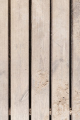 Top view on wooden boards. Floor or bridge made of wood. Walkway in the summer park.