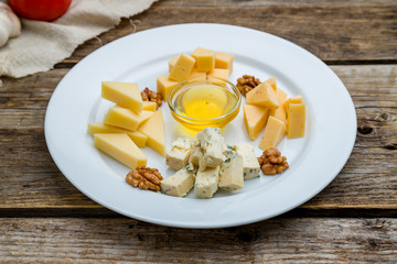 Cheese plate italian food on wooden table