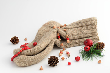 Christmas decorations and natural wool socks on white background. Rustic handmade socks, artificial...