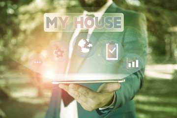 Text sign showing My House. Business photo showcasing A place or building where i live with the showing whom i loved Male human wear formal work suit presenting presentation using smart device