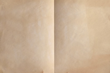 Old weathered sheet of paper folded in half