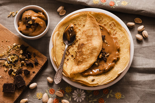 Thin Crepes with Butterscotch and almonds and chopped chocolate. Top view