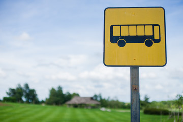 bus stop sign with blue sky background