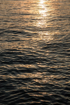 Sunset above the golden lake or the golden sea