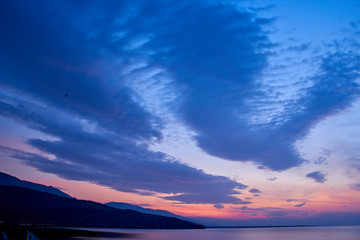 Sunrise about lake Baikal in the summer