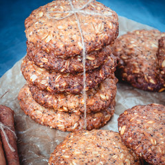 Homemade healthy oat cookies with cinnamon on brown parchment. Healthy food concept. Healthy snack
