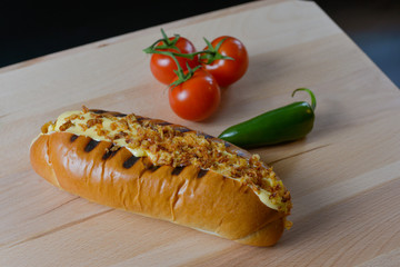 An appetizing meal on a wooden board with fresh vegetables.
