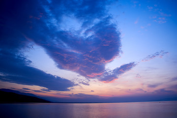 Sunrise about lake Baikal in the summer