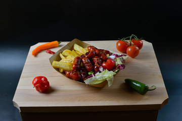 An appetizing meal on a wooden board with fresh vegetables.