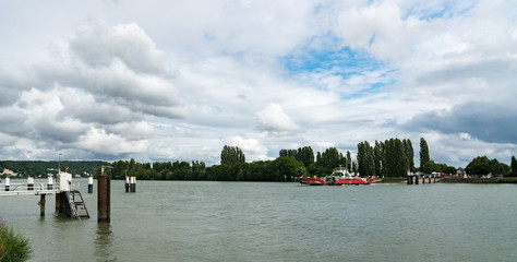 car and truck ferry crossing the Seine River in Duclair in Upper Normandy