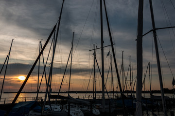 Little save haven with sailboats and a golden sunset