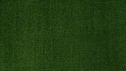 Dark green woven fabric texture background. Closeup