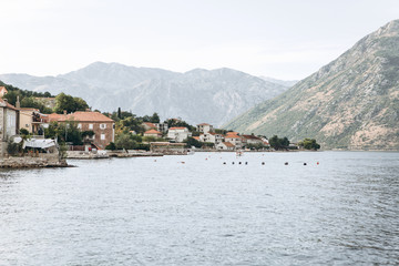 Fototapeta na wymiar Boko Kotor Bay. Beautiful sea and mountain views of the natural landscape and coastal city in Montenegro.