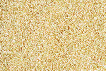 Natural white sesame seeds texture or background. Top view