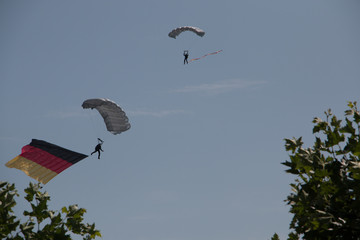 German skydiver in the air with German flag