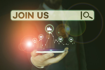 Conceptual hand writing showing Join Us. Concept meaning Register in community Team or blog Sign up at social media Male wear formal suit presenting presentation smart device