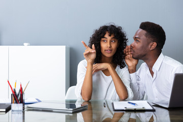 People Laughing About Their Coworker