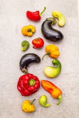 Trendy ugly organic vegetables. Assortment of fresh pepper, eggplant, cucumber, tomato, pumpkin