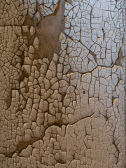 cracked colour paint on and old wall, close-up detail