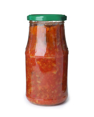 Glass jar with pickled red sauce isolated on white