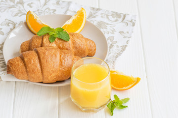  croissants on a white plate with berries breakfast in Paris for a beloved food on a date