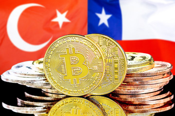 Bitcoins on Turkey and Chile flag background
