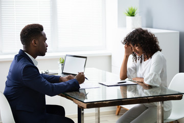 Stressed Young Business Woman Holding Her Head At Interview