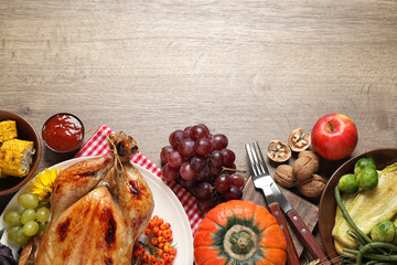 Flat lay composition with turkey on wooden background, space for text. Happy Thanksgiving day