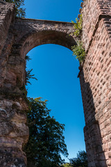 A bridge between castle and tower made of red sandstone