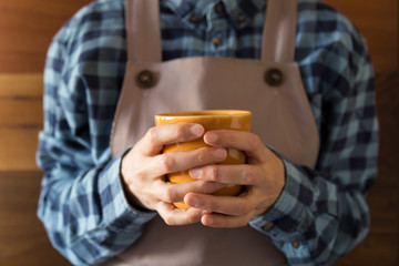 the woman hold the coffee for concept.