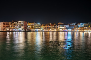city at night by the sea