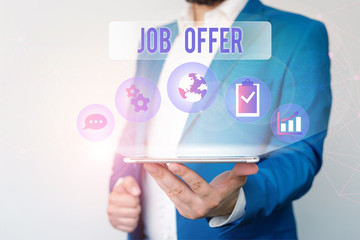 Text sign showing Job Offer. Business photo text A peron or company that gives opurtunity for one s is employment Male human wear formal work suit presenting presentation using smart device