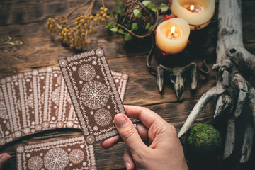 Fortune teller woman reading a future by tarot cards concept.