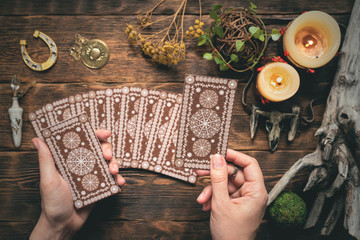 Fortune teller woman reading a future by tarot cards concept.