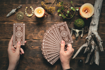 Fortune teller woman reading a future by tarot cards concept.