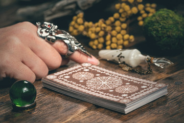 Fortune teller woman reading a future by tarot cards concept.