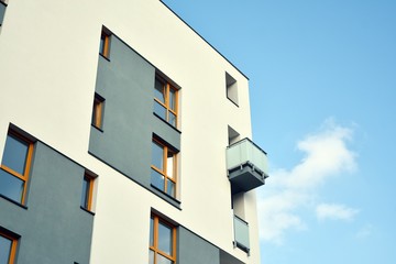 Modern apartment buildings on a sunny day with a blue sky. Facade of a modern apartment building