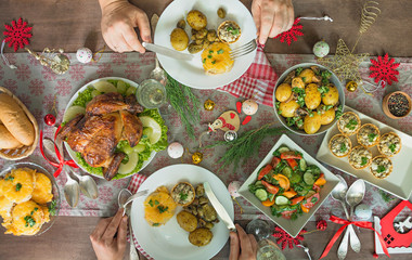 Christmas family dining table. Festive table. Table setting. Presents . New Year. View from above.