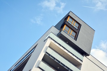 Modern apartment buildings on a sunny day with a blue sky. Facade of a modern apartment building