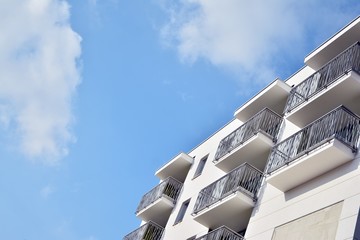 Modern apartment buildings on a sunny day with a blue sky. Facade of a modern apartment building