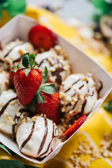 turkish loam. turkish bite dessert with chocolate and white chocolate sauce. strawberry and banana new generation bite