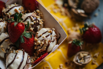 turkish loam. turkish bite dessert with chocolate and white chocolate sauce. strawberry and banana new generation bite