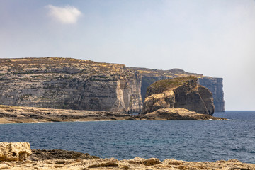 Fototapeta na wymiar Stunning view at the coast of Dwejra Bay with the Fungus Rock on Gozo island in Malta