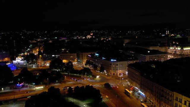 night sunset illumination flight over vienna city center traffic square aerial panorama 4k austria