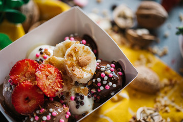 turkish loam. turkish bite dessert with chocolate and white chocolate sauce. strawberry and banana new generation bite