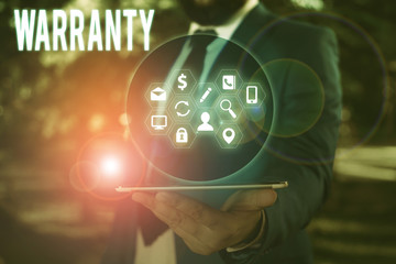 Conceptual hand writing showing Warranty. Concept meaning Free service of repair and maintenance of...